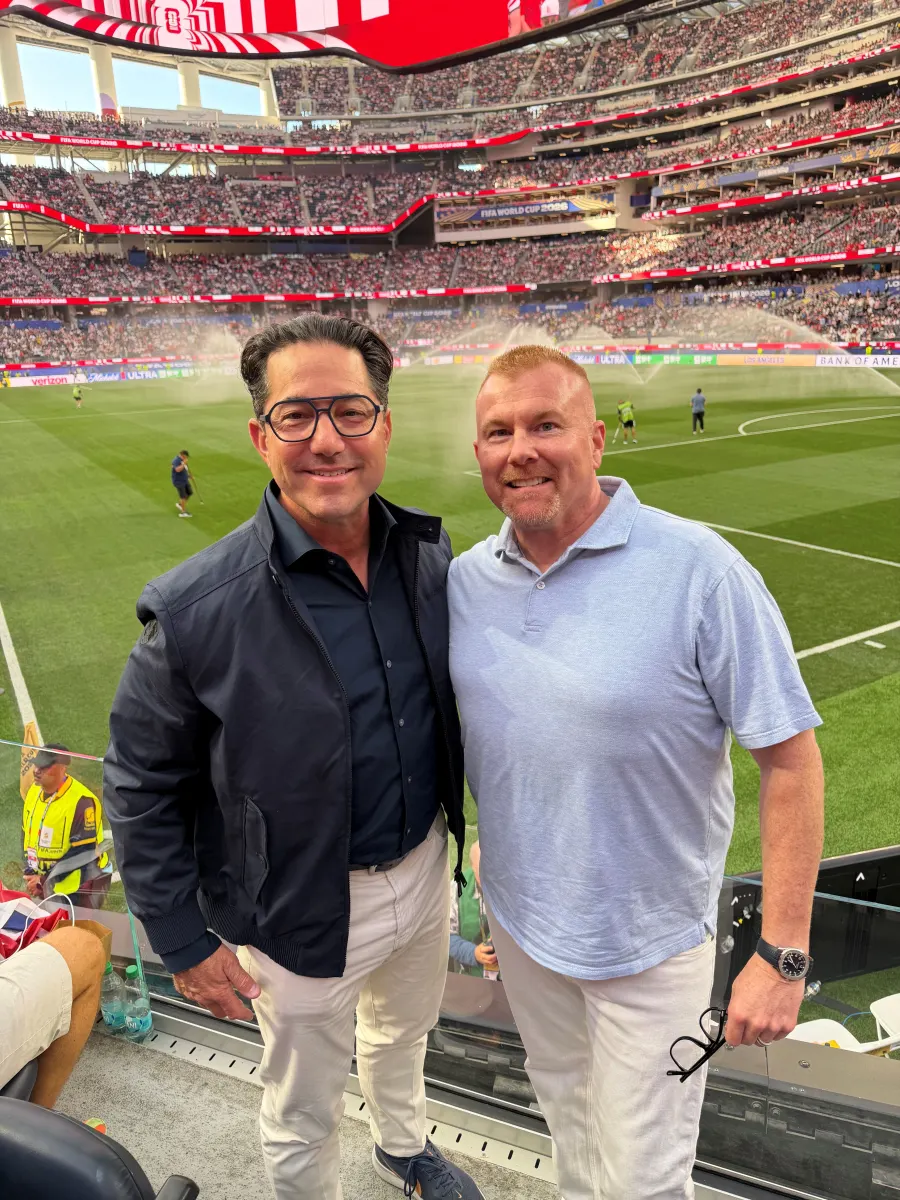 Todd Blue and Mark P. Venti at a stadium